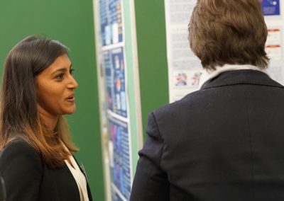 Attendees discuss posters at the 2017 Milner Symposium