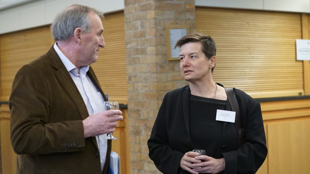 Two attendees networking at the 2017 Milner Symposium